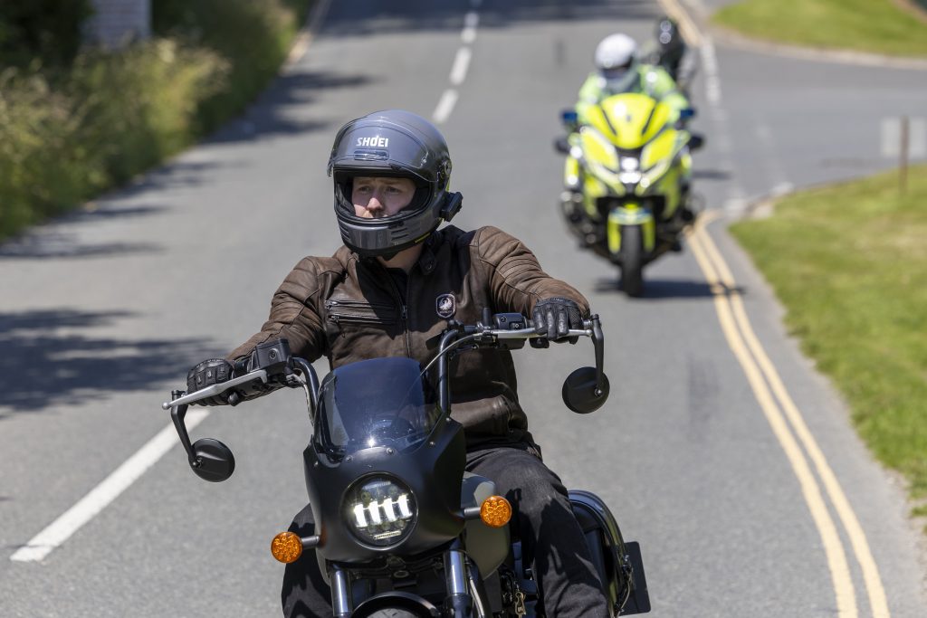 A motorcyclist is followed by a police bike during a BikeSafe workshop